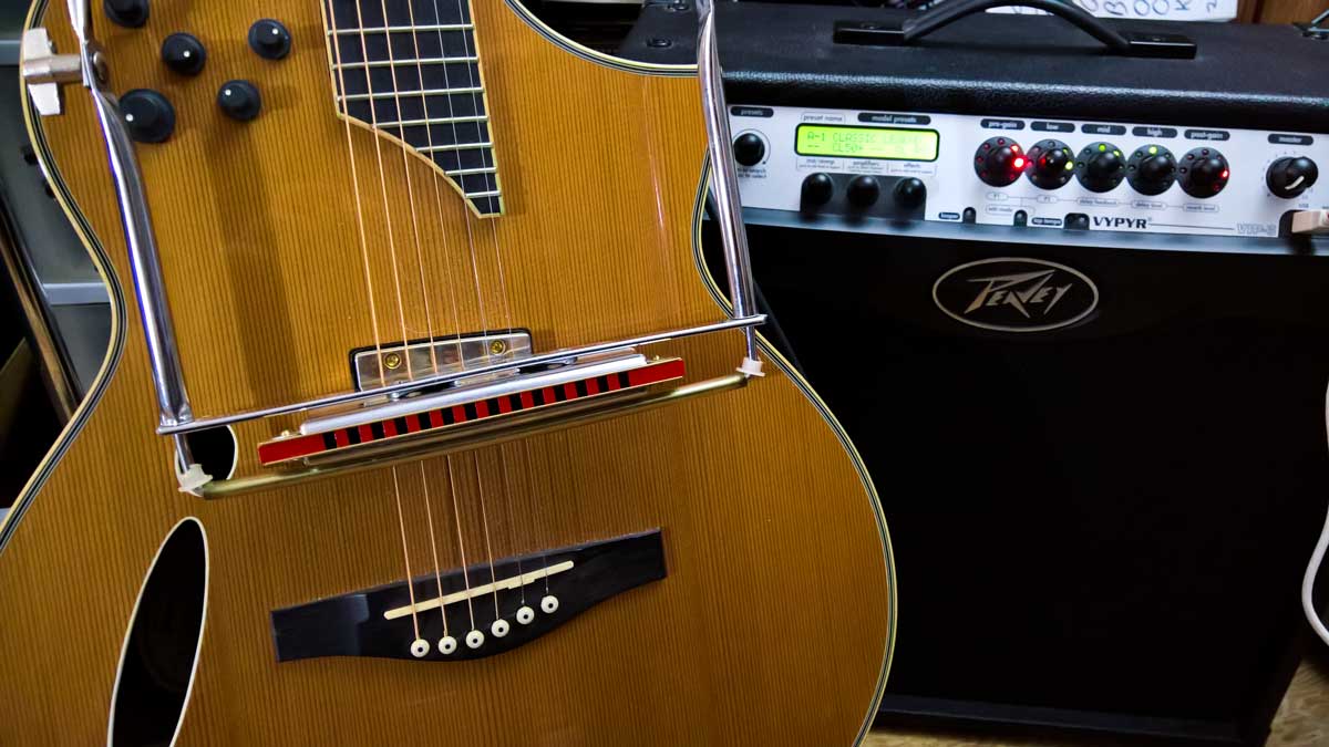 Mitch Ross is a Canadian songwriter, guitar player, multi-instrumentalist and producer. Photo features an Ibanez Montage MSC700NT A/E Hybrid Cutaway Acoustic Electric Guitar and a Peavey VYPYR VIP 3 100W 1x12 Guitar Modeling Combo Amp